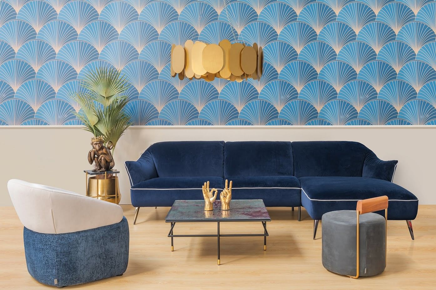 A modern living room features velvet, marble, steel, and fabric in varying shades of predominantly blue and gold. 