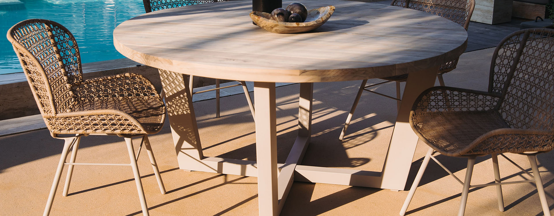 A durable DHPE resin and metal dining chair with a breathable rattan-inspired design 